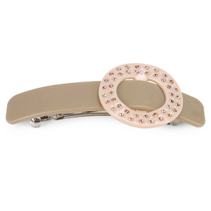 Macro detail of khaki acetate hair clip with pink crystal ring and silver spring mechanism