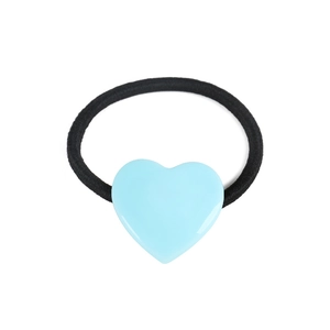 Detail of light blue heart resin charm on a durable black elastic ponytail holder