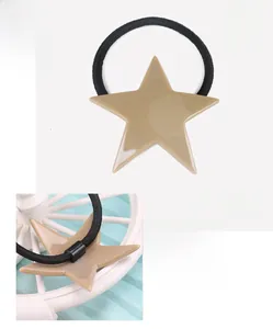 Detail view of khaki acetate star hair tie with net weight 5.0g and 5.3x7.3cm dimensions