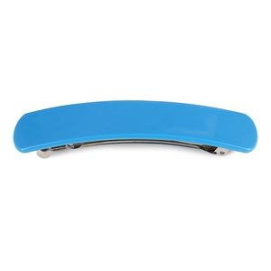 Close-up of bright blue acetate hair clip showing the metallic spring mechanism