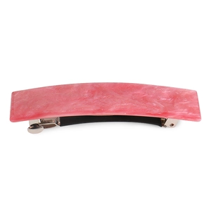 Detail of pink marble acrylic hair clip with silver spring mechanism on white background