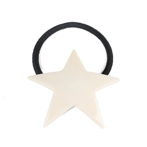 Detail of high-elastic black hair tie with smooth cream acrylic star ornament on white background