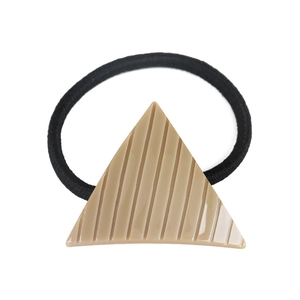 Detail of minimalist khaki geometric triangle hair tie with vertical striped texture