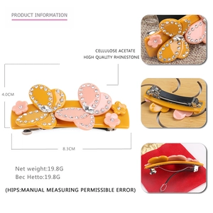 Pink and yellow acetate bow hair clip with Czech rhinestones and floral accents