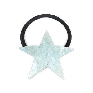 Detail of mint blue star hair tie with marble texture and subtle golden glitter