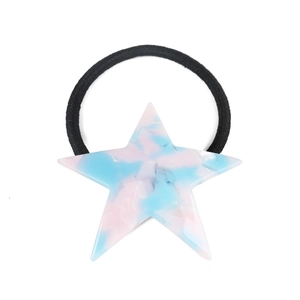 Detail of star-shaped hair tie with pink and blue marbled acrylic texture on elastic band