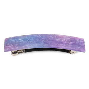Detailed view of a purple and blue gradient acrylic hair clip with shimmering glitter finish