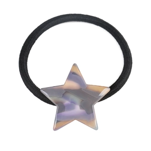 Detail of star-shaped marble hair tie with thick black elastic band and acrylic finish