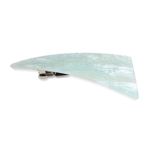 Macro shot of marble-patterned mint green acrylic hair clip with metallic spring clamp
