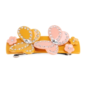 Handmade acetate hair clip with yellow resin base, pink butterflies, and crystal flowers