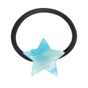 Detail of black elastic hair tie with a light blue acrylic star featuring marble patterns
