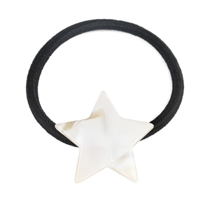 Detail of a minimalist black elastic hair tie with a marbled star-shaped resin pendant