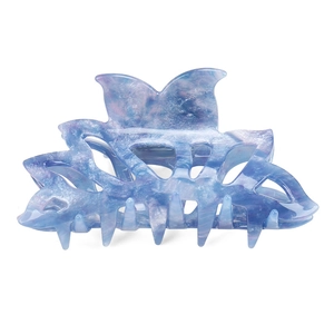 Detail view of large marbled blue and purple acetate hair claw with butterfly shape