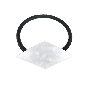 Minimalist geometric acetate hair tie with white marble texture on a black elastic band