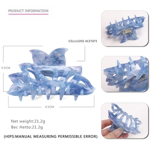 Blue marble acetate hair claw clip with geometric hollow design and 9.5cm length
