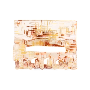 Detail of hollow rectangular hair claw clip with beige and brown checkered pattern