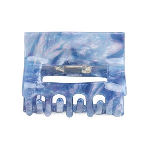 Detailed close-up of blue and purple marble texture on a square hollow hair claw clip