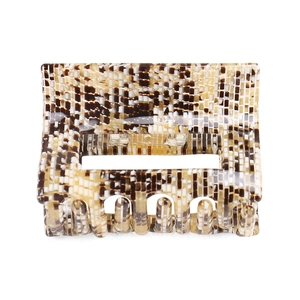 Macro detail of the square hair claw clip featuring a brown animal print texture
