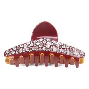 Vue détaillée de la grande pince à cheveux bordeaux ornée de strass blancs brillants