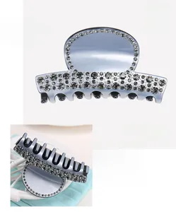 Detail view of acetate hair claw with rhinestones, 8.9x4.9cm size and 29.4g weight