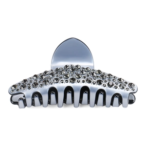Détail de la pince à cheveux de luxe en acétate bleu avec strass en cristal gris
