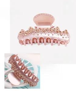 Detailed view of pink acetate hair claw clip with rhinestones and size measurements