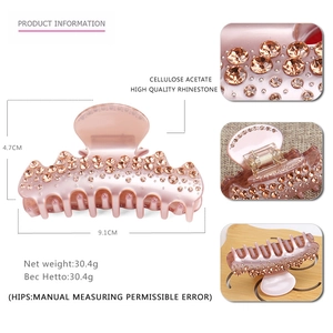 Detailed macro view showing high-quality rhinestones and acetate material on hair claw