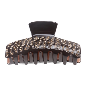 Detail shot of a dark brown large hair claw clip with sparkling champagne rhinestones