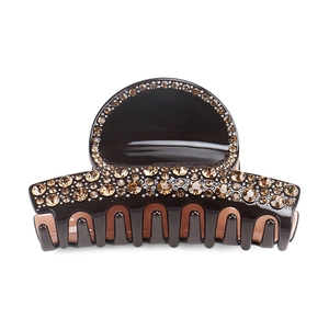 Detail of amber rhinestone inlay on large dark brown acetate hair claw clip