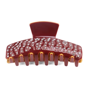 Luxurious acetate hair claw clip with sparkling rhinestones in deep red and yellow finish