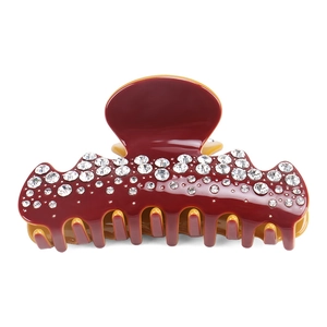 Detail of burgundy acetate hair claw clip with multiple sparkling white rhinestones