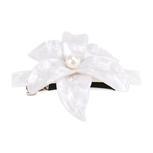 Detail of white acetate lily hair clip with pearlescent petals and a center pearl stud