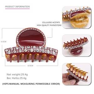 Deep red cellulose acetate hair claw with rhinestones and dimension markings