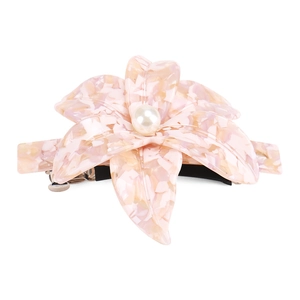 Close-up of pink marble acetate camellia hair clip with center pearl and metal spring