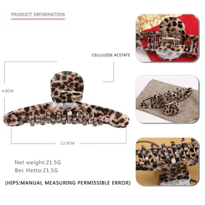 Detail showing cellulose acetate leopard print hair claw clip dimensions and spring mechanism