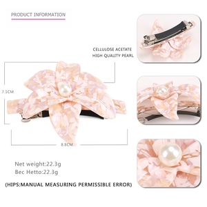 Pink acetate flower hair clip with marble texture and large white pearl center