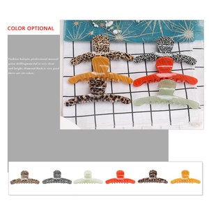 Set of six colorful large acetate shark hair clips in leopard, amber, and marble patterns
