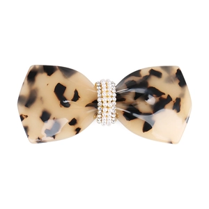 Detail of tortoise shell acetate bow hair clip with faux pearls and rhinestones