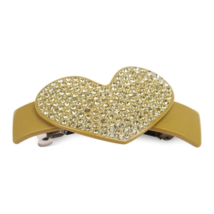 Macro shot of sparkling heart hair clip with pavé rhinestones on yellow acetate base