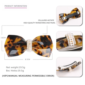 Vintage acetate bow hair clip with leopard tortoise pattern and pearl rhinestone detail