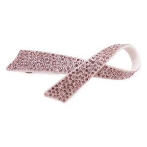 Vue détaillée d'une pince à cheveux nœud en acétate rose avec strass luxueux