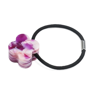 Detail view of purple marble acetate clover charm on black elastic hair tie with silver bead