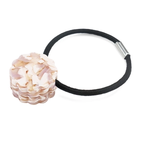 Close-up of acetic hair tie with pink marble petal design and high elastic black rope
