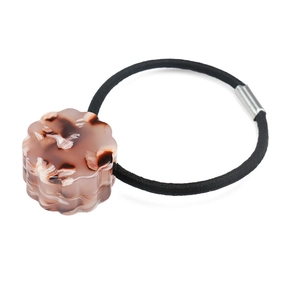 Close-up of black high-elastic hair tie with round marble-patterned acetate ornament