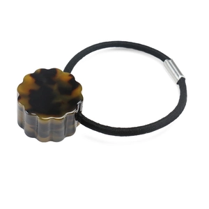 Detail of tortoiseshell acetate hair tie with high elastic band and silver metal connector