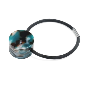 Close-up of geometric acetate bead ponytail holder with high elasticity black rubber band