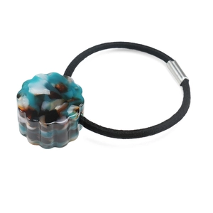 Detail of high-elastic hair tie with blue marble acetate cylinder and silver metal clasp