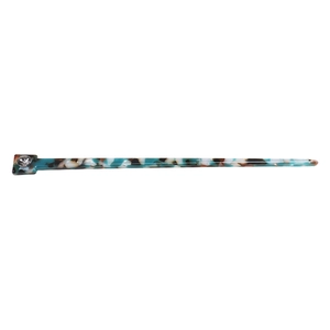 Close-up of vintage acetate hair stick with tortoise texture and inlaid crystal