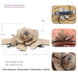 Elegant apricot acrylic floral hair clip with black edges and metal spring barrette