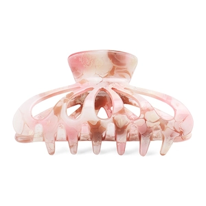 Detailed close-up of pink marble pattern hair claw clip with hollow acetate finish